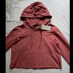 rose colored cropped hoodie